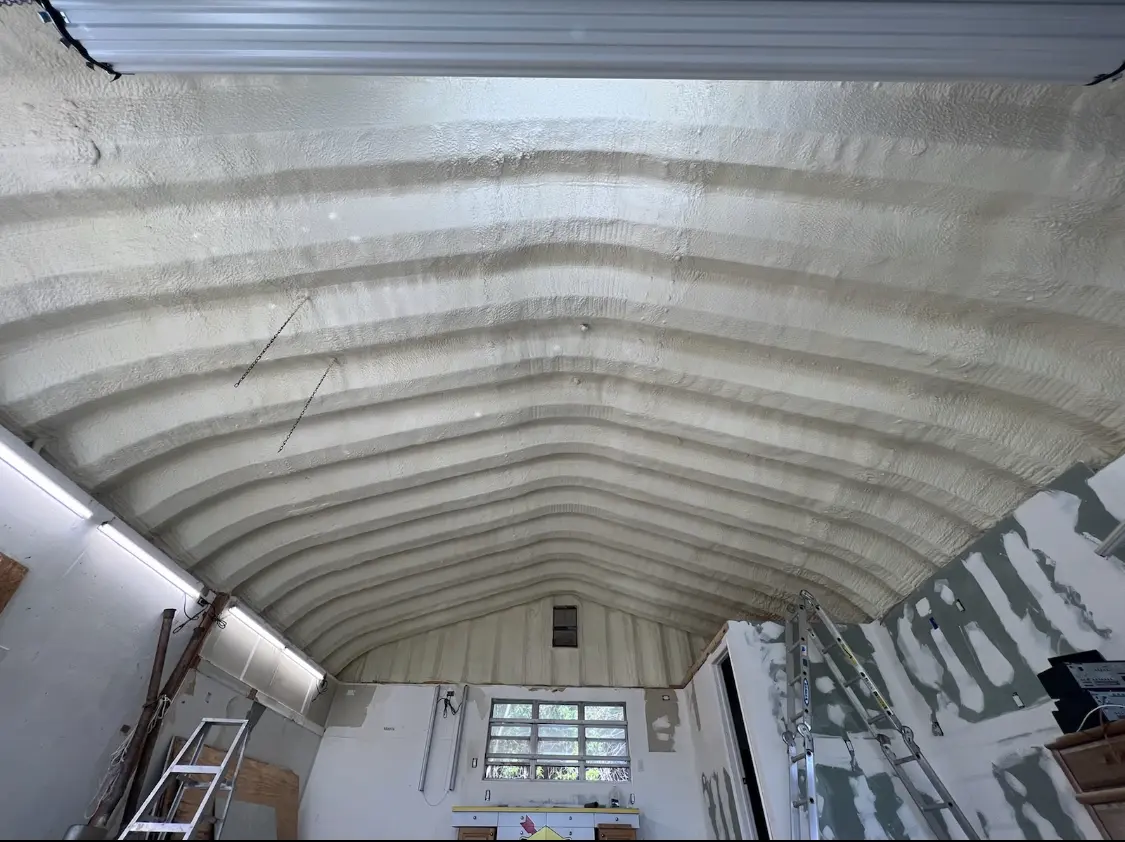Spray polyurethane foam applied to the underside of a metal roof deck in Gloucester City